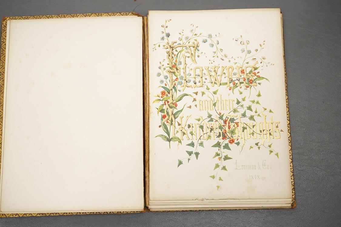Two early 20th century stamped leather books with illuminated pages, calligraphy and floral designs